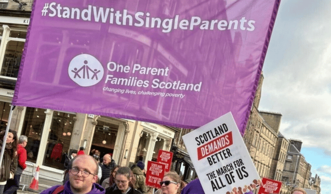 OPFS at the Scotland Demands better march holding a banner: stand with single parents